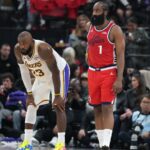 Dec 20, 2025; Inglewood, California, USA; Los Angeles Lakers forward Lebron James (23) and LA Clippers guard James Harden (1) react in the first half at Intuit Dome.