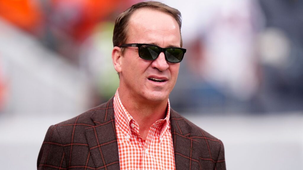 Peyton Manning looks on before the game between the Denver Broncos and New York Giants at Empower Field at Mile High.