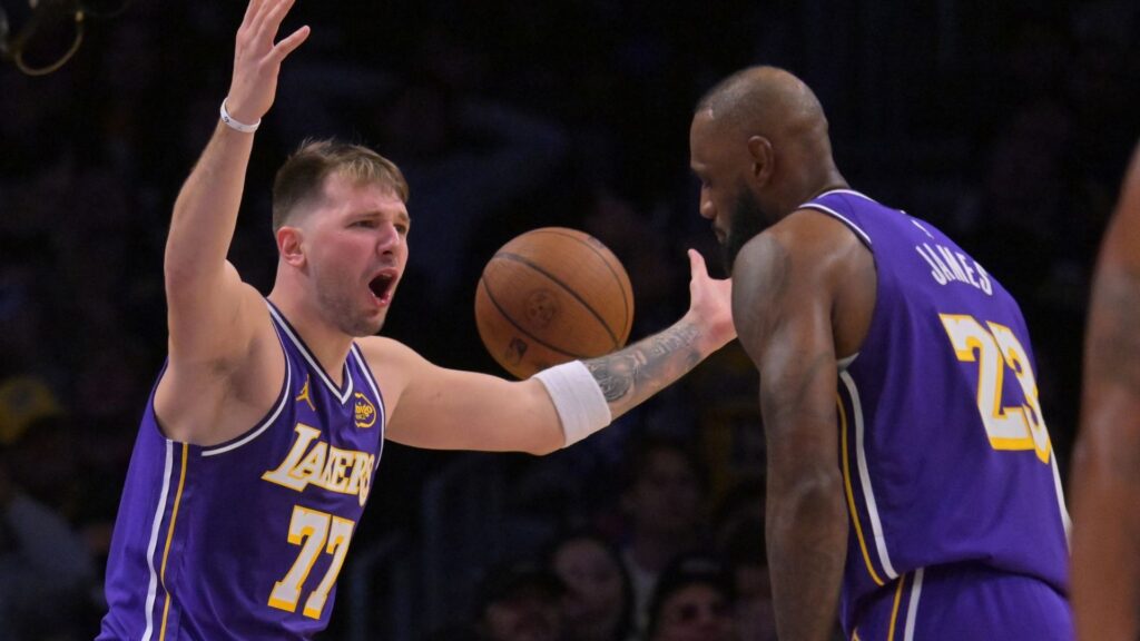 Dec 10, 2025; Los Angeles, California, USA; Los Angeles Lakers guard Luka Doncic (77) and forward Lebron James (23) react after a foul call during the second half against the San Antonio Spurs at Crypto.com Arena