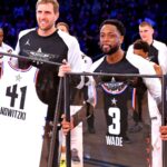 Feb 17, 2019; Charlotte, NC, USA; Team Lebron guard Dwayne Wade of the Miami Heat (3) and Team Giannis forward Dirk Nowitzki of the Dallas Mavericks (41) are honored during the 2019 NBA All-Star Game at Spectrum Center.