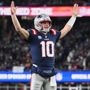 New England Patriots quarterback Drake Maye (10) reacts to a Patriots touchdown scored against the Miami Dolphins during the first quarter at Gillette Stadium.
