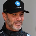 Feb 16, 2025; Daytona Beach, Florida, USA; NASCAR Cup Series driver Jimmie Johnson (84) walks to the drivers meeting before the Daytona 500 at Daytona International Speedway.