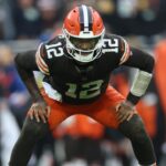 Cleveland Browns quarterback Shedeur Sanders (12) stretches during a time out in the fourth quarter against the Pittsburgh Steelers at Huntington Bank Field.