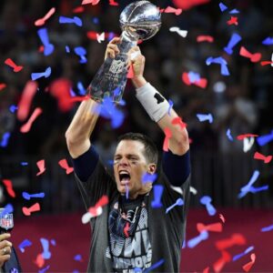 New England Patriots quarterback Tom Brady celebrates with the Vince Lombardi Trophy after defeating the Atlanta Falcons 34-38 in Super Bowl LI at NRG Stadium.