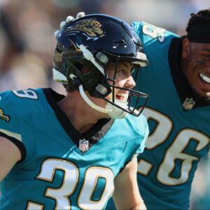 Jacksonville Jaguars placekicker Cam Little (39) celebrates with safety Antonio Johnson (26) after kicking a sixty-seven yard field goal against the Tennessee Titans during the second quarter at EverBank Stadium.