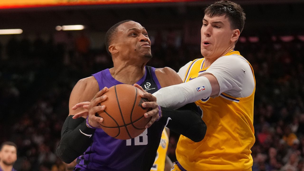 Sacramento Kings guard Russell Westbrook (18) is fouled by Los Angeles Lakers forward Jake LaRavia (12) in the fourth quarter at the Golden 1 Center.