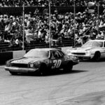 Cale Yarborough (11) attempts to get around Walter Ballard (30) during the Nashville 420 Grand National race at Nashville Speedway on July 20, 1975. Yarborough went on to finished a full one and one-quarter laps ahead of second place Richard Petty before a crowd of 16,500.