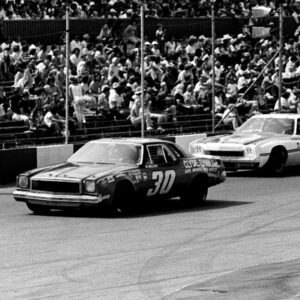 Cale Yarborough (11) attempts to get around Walter Ballard (30) during the Nashville 420 Grand National race at Nashville Speedway on July 20, 1975. Yarborough went on to finished a full one and one-quarter laps ahead of second place Richard Petty before a crowd of 16,500.