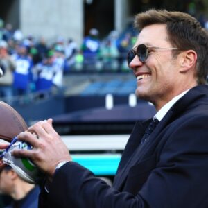 Tom Brady signs autographs before the 2026 NFC Championship Game between the Seattle Seahawks and the Los Angeles Rams at Lumen Field.
