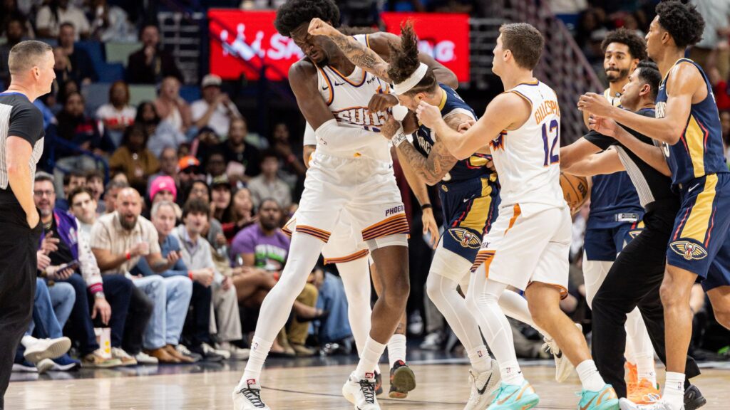 Dec 27, 2025; New Orleans, Louisiana, USA; New Orleans Pelicans guard Jose Alvarado (15) gets into a scrum with Phoenix Suns center Mark Williams (15) over a play during the second half at Smoothie King Center