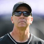 Baltimore Ravens offensive coordinator Todd Monken on the field before the game against the Washington Commanders at M&T Bank Stadium.
