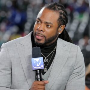 Richard Sherman is seen on the Thursday Night Football set before the game between the New York Giants and the Philadelphia Eagles at MetLife Stadium.