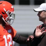 Browns quarterback Shedeur Sanders works with offensive coordinator Tommy Rees during rookie minicamp May 9, 2025, in Berea.