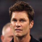 Former NFL player Tom Brady on the field before the game between the Dallas Cowboys and the Las Vegas Raiders at AT&T Stadium.