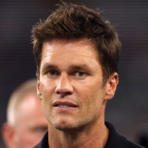 Former NFL player Tom Brady on the field before the game between the Dallas Cowboys and the Las Vegas Raiders at AT&T Stadium.