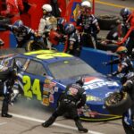 May 1, 2006; Talladega, AL, USA; Nascar Nextel Cup driver Jeff Gordon of the (24) DuPont Chevrolet Monte Carlo makes a pit stop during the Aarons 499 at Talladega Superspeedway