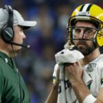 Coach Mike McCarthy talks with Green Bay Packers quarterback Aaron Rodgers during a break in the second half during the Green Bay Packers 31-23 loss to the Detroit Lions at Ford Field. Packlions 32ofx Wood