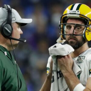 Coach Mike McCarthy talks with Green Bay Packers quarterback Aaron Rodgers during a break in the second half during the Green Bay Packers 31-23 loss to the Detroit Lions at Ford Field. Packlions 32ofx Wood