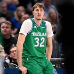 Jan 12, 2026; Dallas, Texas, USA; Dallas Mavericks forward Cooper Flagg (32) looks on during the second half against the Brooklyn Nets at the American Airlines Center