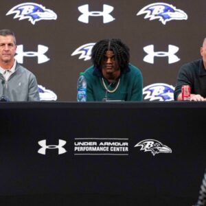 Baltimore Ravens head coach John Harbaugh, quarterback Lamar Jackson, and general manager Eric DeCosta listen to a question asked at a press conference at Under Armour Performance Center.