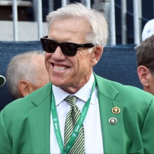 Former NFL player John Elway watches from the first hole tee box with other VIP guests before the opening ceremony during the first round of the BMW Championship golf tournament at Castle Pines Golf Club.