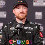 Feb 11, 2026; Daytona Beach, Florida, USA; NASCAR Cup Series driver Tyler Reddick (45) speaks to the media during the Daytona 500 Media Day at Daytona International Speedway.