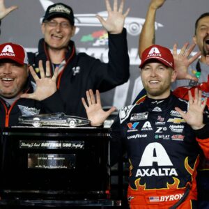 Feb 16, 2025; Daytona Beach, Florida, USA; NASCAR Cup Series driver William Byron (24) poses with the Harley J. Earl trophy after winning the Daytona 500 at Daytona International Speedway.