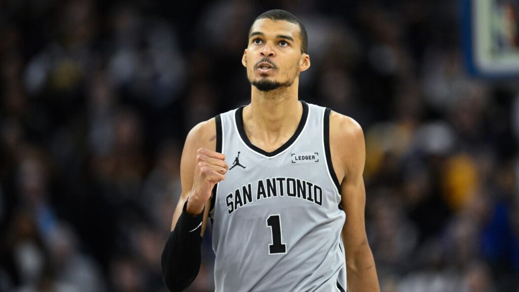 San Antonio Spurs forward Victor Wembanyama (1) celebrates a three-point basket against the Golden State Warriors in the fourth quarter at Chase Center.