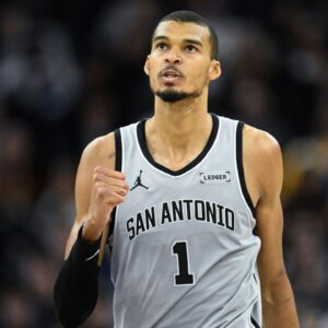 San Antonio Spurs forward Victor Wembanyama (1) celebrates a three-point basket against the Golden State Warriors in the fourth quarter at Chase Center.