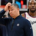 Los Angeles Clippers head coach Tyronn Lue scratches his head after calling a time out as forward Kawhi Leonard (2) walks past in the first half against the Toronto Raptors at Scotiabank Arena.
