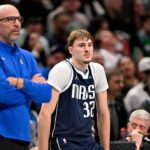 Dallas Mavericks head coach Jason Kidd and forward Cooper Flagg (32) look on during the game between the Mavericks and the 76ers at American Airlines Center.