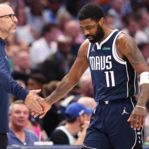 May 28, 2024; Dallas, Texas, USA; Dallas Mavericks head coach Jason Kidd high fives guard Kyrie Irving (11) during the third quarter against the Minnesota Timberwolves in game four of the western conference finals for the 2024 NBA playoffs at American Airlines Center.