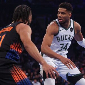 Nov 28, 2025; New York, New York, USA; Milwaukee Bucks forward Giannis Antetokounmpo (34) dribbles as New York Knicks guard Jalen Brunson (11) defends during the first half at Madison Square Garden. Mandatory Credit: Vincent Carchietta-Imagn Images
