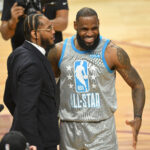 Feb 19, 2023; Salt Lake City, UT, USA; Carmelo Anthony, Dwyane Wade and LeBron James greet each other before the 2023 NBA All-Star Game at Vivint Arena