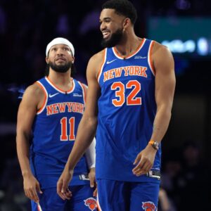 Feb 14, 2026; Los Angeles, CA, USA; Team Knicks guard Jalen Brunson (11) of the New York Knicks and center Karl-Anthony Towns (32) of the New York Knicks react during the shooting stars competition during the 2026 NBA All Star Saturday Night at Intuit Dome