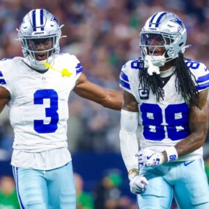 Dallas Cowboys wide receiver George Pickens (3) and Dallas Cowboys wide receiver CeeDee Lamb (88) react during the game against the Philadelphia Eagles at AT&T Stadium.