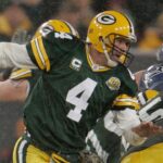 Green Bay Packers quarterback Brett Favre has to scramble but makes it outside to complete a shovel pass to Donald Lee during the second quarter of the Green Bay Packers and Seattle Seahawks NFL playoff game on Saturday, Jan. 12, 2008, at Lambeau Field.