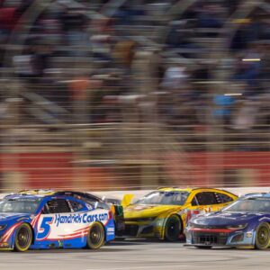 Feb 23, 2025; Hampton, Georgia, USA; Kyle Larson (5) fights for position during the final laps at Atlanta Motor Speedway.