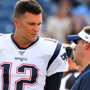 New England Patriots quarterback Tom Brady (12) talks with New England Patriots offense coordinator Josh McDaniels before the game against the Tennessee Titans at Nissan Stadium. Mandatory