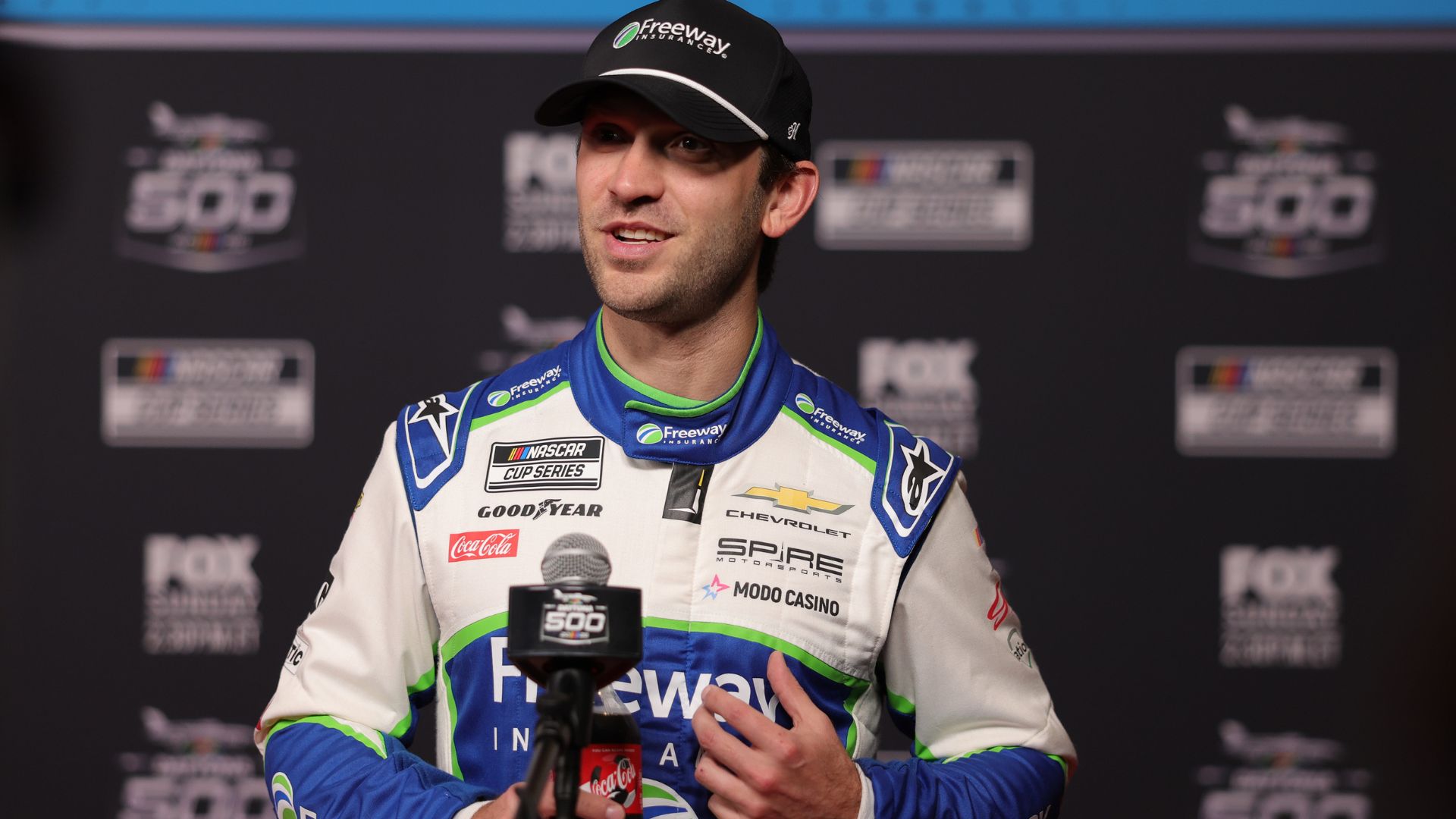 Feb 11, 2026; Daytona Beach, Florida, USA; NASCAR Cup Series driver Daniel Suarez (7) speaks to the media during the Daytona 500 Media Day at Daytona International Speedway.