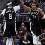 Milwaukee Bucks forward Giannis Antetokounmpo high fives forward Bobby Portis (9) during the second quarter at Fiserv Forum.