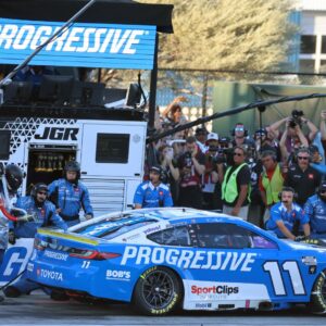 Nov 2, 2025; Avondale, Arizona, USA; NASCAR Cup Series driver Denny Hamlin (11) makes a pit stop during the NASCAR Championship race at Phoenix Raceway