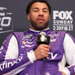 Feb 11, 2026; Daytona Beach, Florida, USA; NASCAR Cup Series driver Bubba Wallace (23) speaks to the media during the Daytona 500 Media Day at Daytona International Speedway