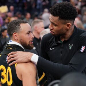 Milwaukee Bucks forward Giannis Antetokounmpo (34) and Golden State Warriors guard Stephen Curry (30) meet after the game at the Chase Center.