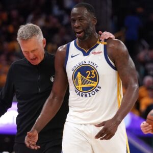 Golden State Warriors forward Draymond Green (23) walks towards the team bench with head coach Steve Kerr after a play against the Memphis Grizzlies in the third quarter at the Chase Center.