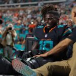 Miami Dolphins wide receiver Tyreek Hill (10) reacts after being placed on a medical cart against the New York Jets during the second half at Hard Rock Stadium.