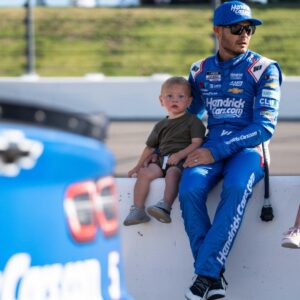 NASCAR Cup Series driver Kyle Larson sits with his children before the start of the race on Sunday, June 16, 2024, at the Iowa Speedway in Newton.