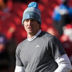 Los Angeles Chargers quarterback Justin Herbert (10) participates in early pregame warmups against the Kansas City Chiefs at GEHA Field at Arrowhead Stadium.
