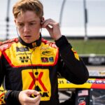 Connor Zilisch (88) puts in earpieces during NASCAR Xfinity Series qualifying on Aug. 2, 2025, at Iowa Speedway in Newton, Iowa.