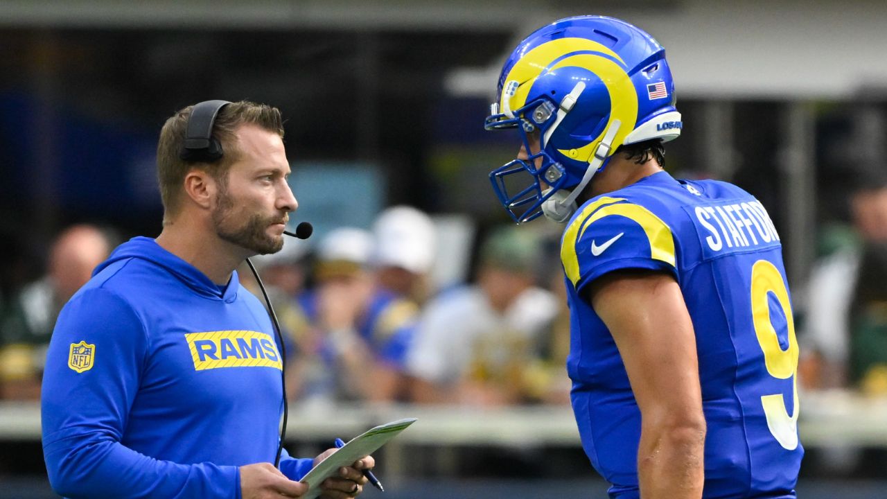 Los Angeles Rams head coach Sean McVay talks to quarterback Matthew Stafford (9) during the third quarter against the Green Bay Packers at SoFi Stadium.